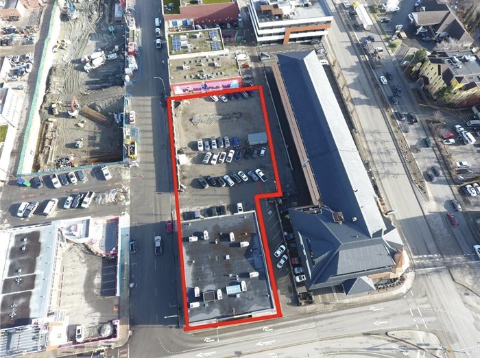 This shows the properties outlined in red with the Prestige Beach House on the right, Water Street by the Park under construction upper left and the Gospel Mission boardering them at the top.