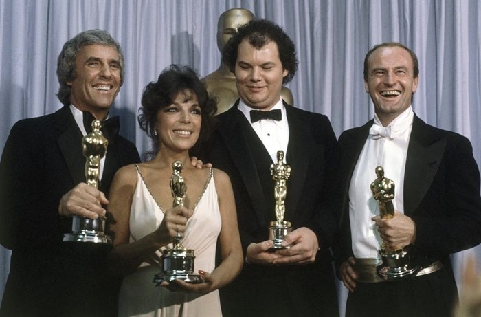 FILE - Burt Bacharach, from left, appears with Carole Bayer Sager, Christopher Cross and Peter Allen, winners of the Oscar for best original song 