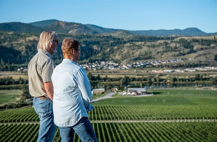 Owners Ed (left) and Vicki Collett overlooking their vineyard at Harper's Trail Estate Winery in Kamloops. 