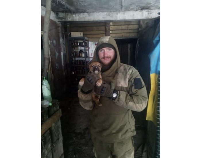 Oleksandr Shkyn in this photo taken in 2017 on the front lines of the war in Ukraine with Tyson he rescued as a puppy. Tyson is now living in Penticton and Oleksandr remains in Ukraine.