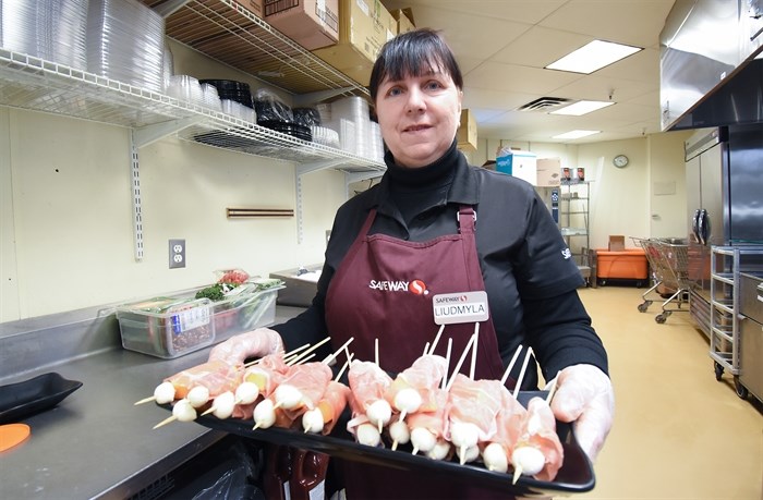 Liudmyla Shkyn is now working in the deli at Safeway, a job she loves.