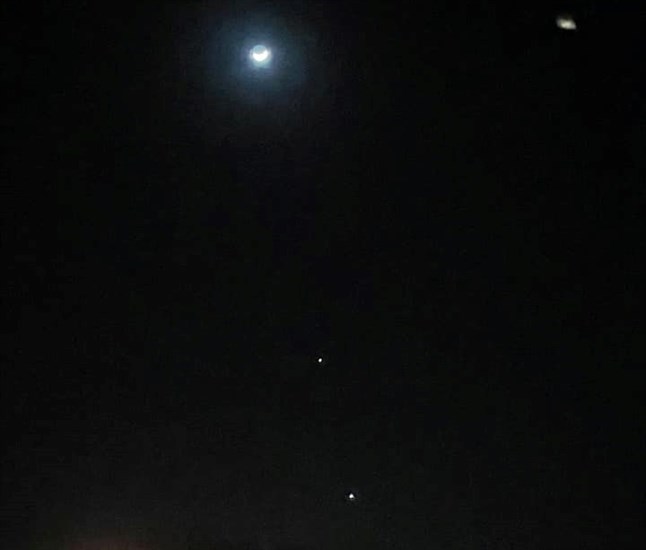 Moon, Jupiter and Venus in sky near Monte Lake. 