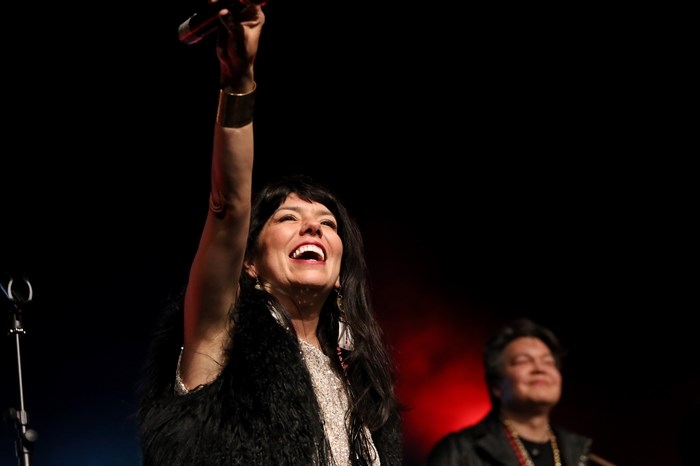 Husband and wife duo ShoShona Kish, left, and Raven Kanatakta of Indigenous musical group Digging Roots perform at the 2023 sk?l?ap Movable Feast show in snpintktn (Penticton) in syilx homelands on March 29, 2023.