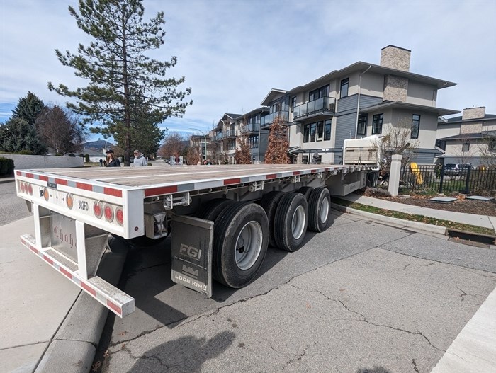 A semi truck with a trailer crashed into a Kelowna townhouse at Cameron Avenue at Gordon Road Tuesday, April 11, 2023.
