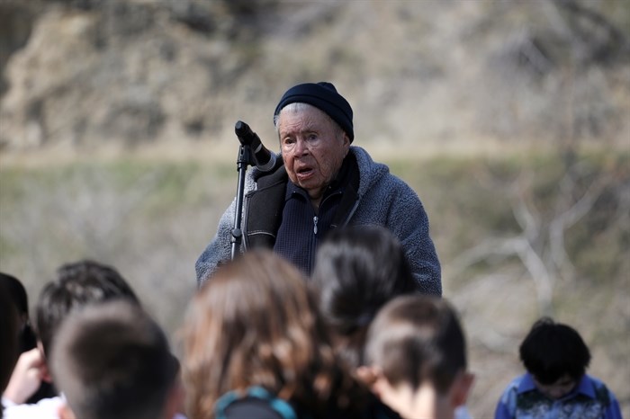 Elder q??ayxnmitk? x??stalk?iya? Jane Stelkia, 93, the oldest member of OIB, speaks in front of Youth during the Osoyoos Indian Band’s celebration on April 14, 2023, of a reclaimed one acre of their original reserve land.