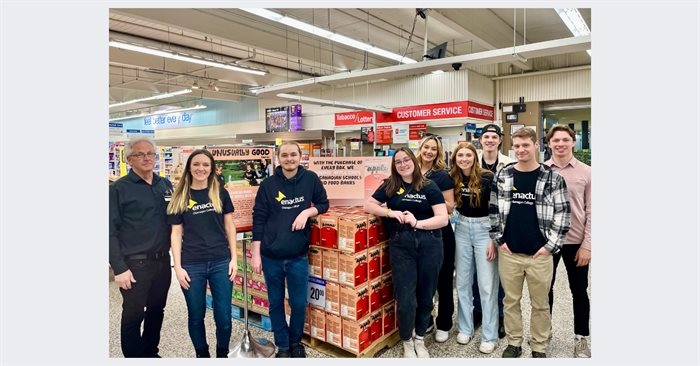 (Left to right) Peter Boyd, owner of Peter’s Your Independent Grocer, unusually Good Foods manager Mandi Kohout, Andrew Loken, Michaela Dew, MacKenna Lenarcic, Rebekah Dingwall, Carter Thompson, Mitchell Vanlerberg, and Jackson Price