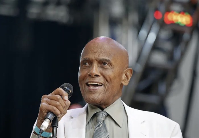 FILE - Singer and activist Harry Belafonte speaks during a memorial tribute concert for folk icon and civil rights activist Pete Seeger in New York on July 20, 2014. Belafonte died Tuesday of congestive heart failure at his New York home. He was 96. 