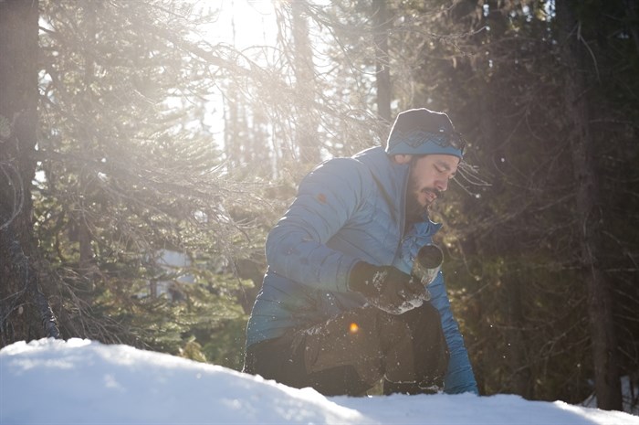 Mark Wong, a B.C. ecosystems biologist, retrieves a camera that was mounted on a tree beside a path used by snowmobilers. When the areas are closed to motorized traffic, the government team works with the local snowmobile clubs to ensure the public stays out, but camera traps are set up to catch anyone ignoring the rules.