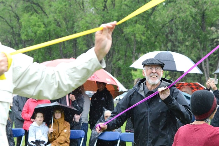 Longtime Naramatian and former May Day emcee John Moorhouse took part in the adult May Pole dance at Monday's annual celebration, the 100th anniversary of the event in the community.