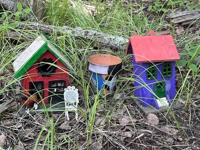 Painted fairy house and barn, with toy horse and chair added. 