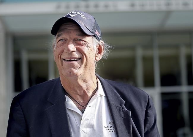 FILE - Former Minnesota Gov. Jesse Ventura talks to reporters outside the federal building on Oct. 20, 2015, in St. Paul, Minn. Ventura, who supported marijuana legalization when he served from 1999-2003, is expected to attend the signing ceremony of a bill Tuesday, May 30, 2023, to legalize recreational marijuana for people over the age of 21. Minnesota Democratic Gov. Tim Walz said in November that Ventura would be invited because Ventura was one of the first governors in the country to support legalization.