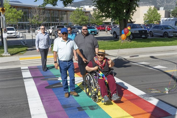 Grandma Grace Greyeyes, PIB Chief Greg Gabriel and Councillor Ryan Garaham lead the way across Penticton's new inclusive crosswalk. 