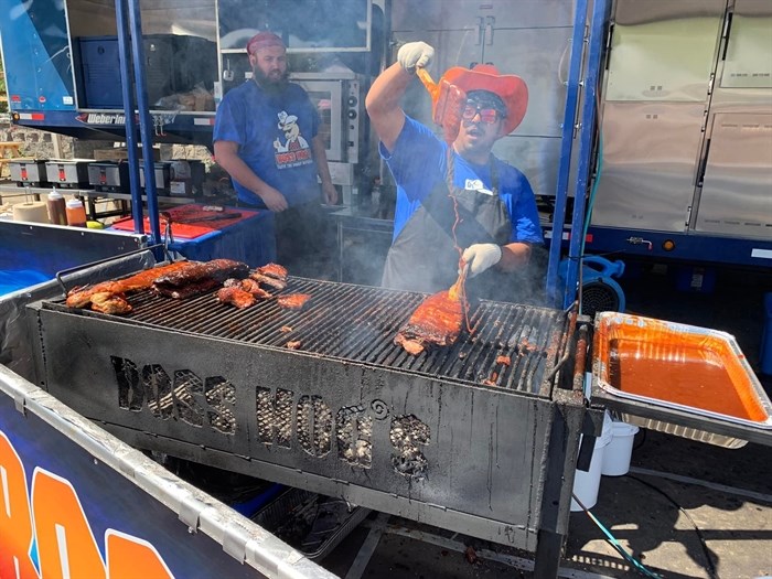 Two cooks compete at Vernon Ribfest last year, 2022.
