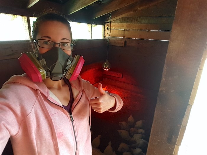 Sayward resident Shannon Briggs, pictured above in 2018, regularly wears a respirator during summer wildfire season due to smoke.