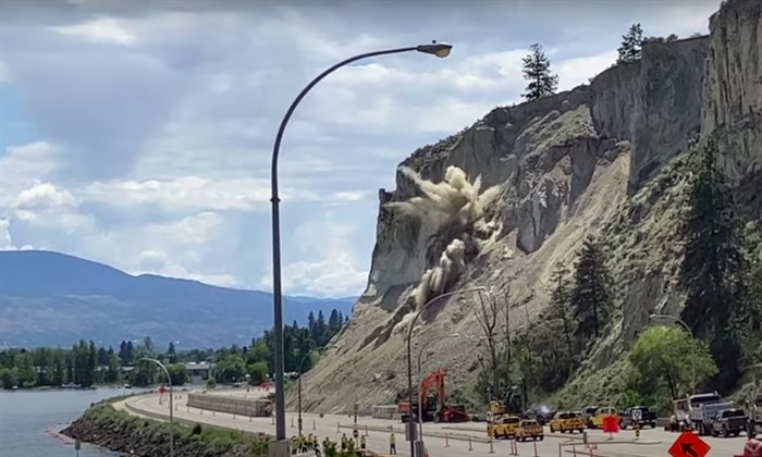 Blasting chipped away at the cliffs beside Highway 97 in Summerland on June 22. 