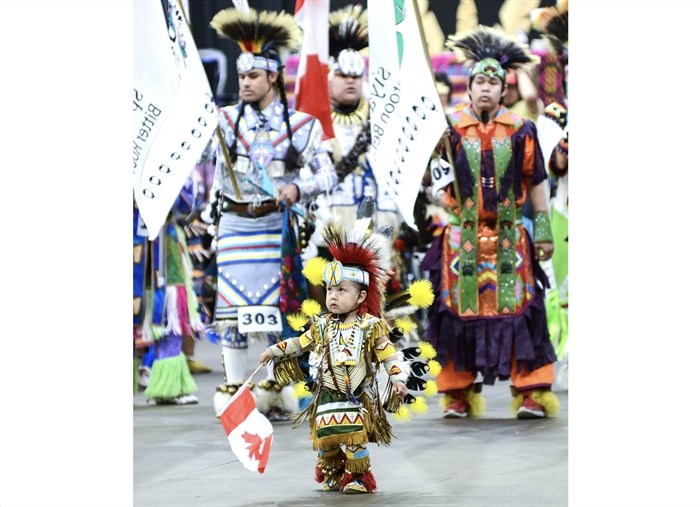 A tiny tot dancer leads the grand entry to Saturday's Pow Wow Between the Lakes Saturday, June 24, 2023, at the South Okanagan Events Centre.