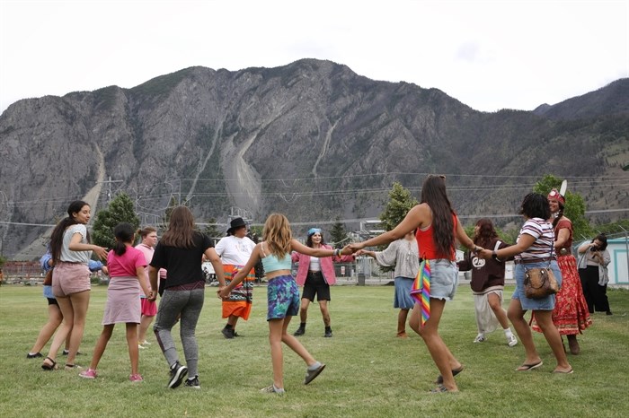 Community members participate in a round dance during the Lower Similkameen Indian Band’s third annual Pride carnival in ni?x?ina? (Keremeos) on June 16, 2023.