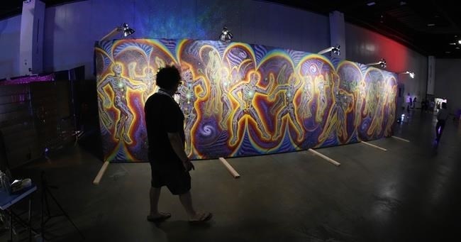 FILE - Artwork on display is seen at the Psychedelic Science conference in the Colorado Convention Center Wednesday, June 21, 2023, in Denver. Australia is the first country to allow psychiatrists to prescribe certain psychedelic substances to patients with depression or post-traumatic stress disorder. On Saturday, July 1, Australian physicians can now prescribe doses of MDMA, also known as ecstasy, for PTSD.