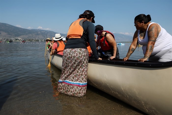 Paddlers prepare a canoe ready for the cross-border journey to Oroville, Washington, from nk’mip (Osoyoos Lake) in sw?iw?s (Osoyoos) in syilx homelands on July 4, 2023.