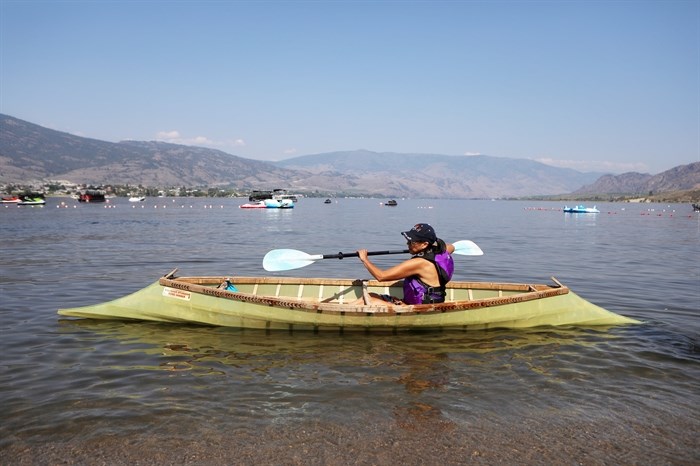 A paddler embarks on the cross-border journey to Oroville, Washington, from nk’mip (Osoyoos Lake) in sw?iw?s (Osoyoos) in syilx homelands on July 4, 2024.
