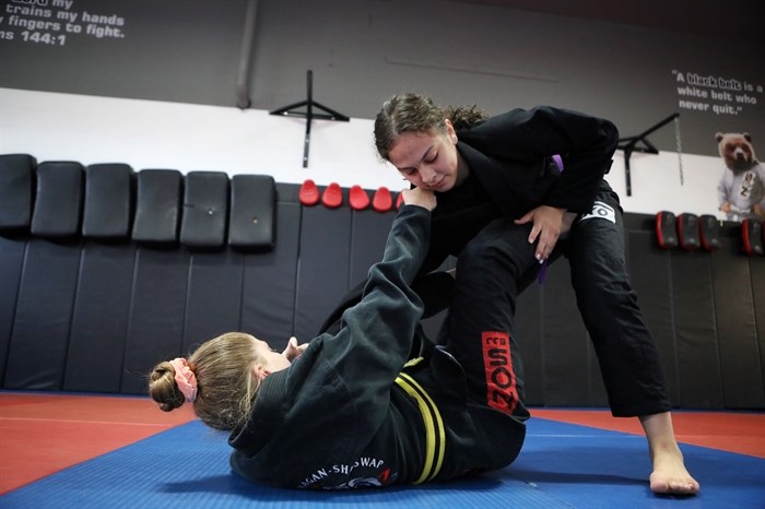 Lillian Marchand trains with one of her students, Taylor Vanderwal, at the North Okanagan-Shuswap Jiu Jitsu and Mixed Martial Arts club in syilx homelands on June 28, 2023.
