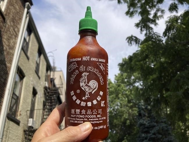 A bottle of Sriracha chili sauce is shown in New York on Thursday, July 13, 2023. Huy Fong Sriracha, which used to go for under $5 or $10 a bottle, is now selling for shocking amounts in some listings posted to Amazon, eBay and Walmart.