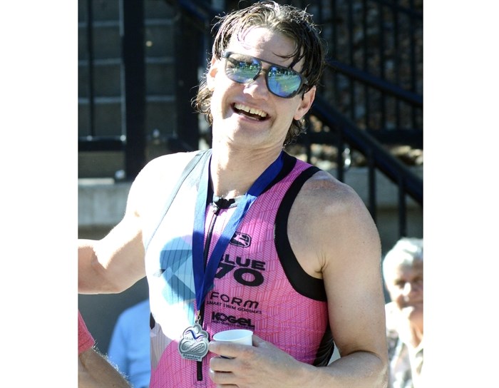 Penticton's Jeff Symonds is all smiles following his first place finish in the Peach Classic standard triathlon division.