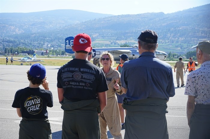 Passengers getting ready to fly on the Second World War-ear B-25 bomber are given a briefing before takeoff at the Penticton airport, Thursday, July 20, 2023.