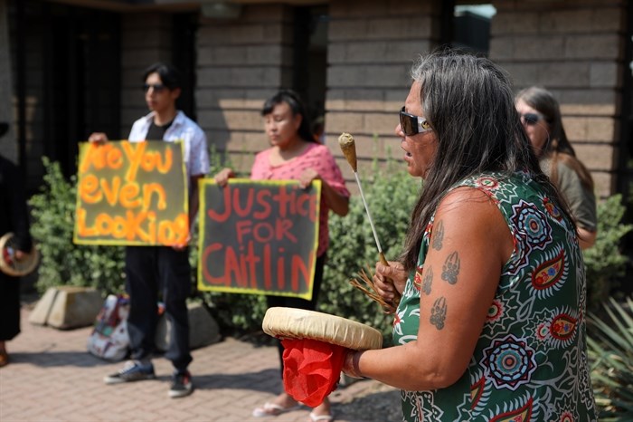 Jody Leon plays a drum song during a rally for Caitlin and other missing women outside of the Vernon RCMP detachment in syilx homelands on July 11, 2023.