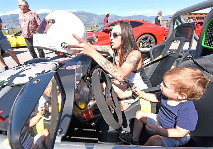 Kreshia Marple and her two-year-old son Maddix have some fun in one of the special vehicles at the Cars for a Cause fundraiser for the OSNS Legacy Foundation.