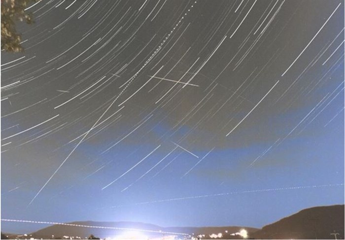 This time-lapse shot of the Perseid meteor shower over Salmon Arm shows the busy night sky with the city below.	
