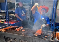 Two cooks compete at Vernon Ribfest last year, 2022.