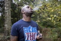 Former NFL tight end Boo Williams smokes medical marijuana at his home in Picayune, Miss., Wednesday, Nov. 15, 2023. Williams needs surgery, medicine and doctors to make the pain subside from injuries he endured during his football career. But he can&#39;t afford any of it. The 44-year-old was recently awarded $5,000 a month by the NFL&#39;s disability benefit plan. But Williams said the plan and the league have repeatedly mishandled his claims and should really have paid him $500,000 or more over the past 14 years. 