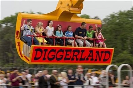 Guest ride in a modified excavator bucket during a preview day at Diggerland USA Thursday, May 22, 2014, in West Berlin, N.J.