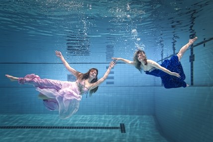 Kamloops swimmers Hailey MacPhee and Kate Liebe pose for an underwater photo shoot. 