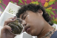 A customer smells cannabis buds at a Cannabis shop in Bangkok, Thailand, Wednesday, May 15, 2024. Prime Minister of Thailand Srettha Thavisin said Wednesday, May 8, 2024 that he wants cannabis to be officially classified as a narcotic drug, a rollback from the complete decriminalization of the plant two years ago.