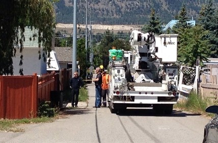 Hydro service arrives to turn off electricity to homes in the area while the investigation into a pipe bomb continues, June 6, 2014.