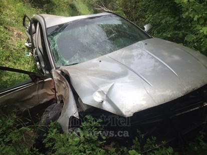A woman had to be rescued from a car involved in an accident near Sun Peaks June 11, 2014.