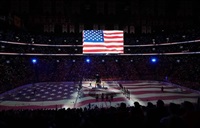 Players and fans stand for the U.S. national anthem before the first period of 4 Nations Face-Off hockey action between Canada and the United States in Montreal on Saturday, Feb. 15, 2025.