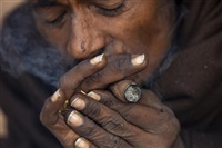 A holy man smokes marijuana at the Pashupatinath Hindu temple during Shivaratri festival in Kathmandu, Nepal, Wednesday, Feb. 26, 2025.