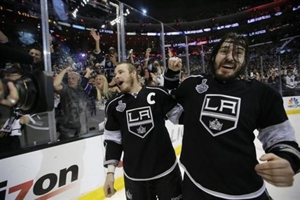 Los Angeles Kings right wing Dustin Brown, left, and teammate defenseman Drew Doughty celebrate.
