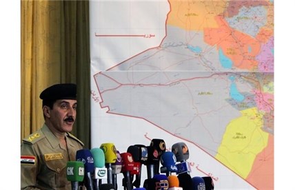 Iraqi Prime Minister's security spokesman, Lieutenant General Qassem Atta speaks during a press conference about the latest military development in Iraq, on June 28, 2014 in the capital Baghdad.