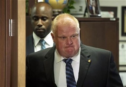 Mayor Rob Ford arrives for an invite-only press conference at City Hall in Toronto after his stay in a rehabilitation facility, on Monday June 30, 2014.