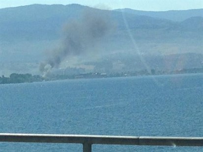 Black smoke could be seen from William R. Bennett Bridge this morning as an RV burned in a Lakeshore Drive driveway July, 16, 2014.