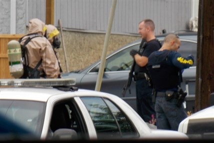 Heavily armed RCMP officers and a Hazmat team were involved in the search of a home in Vernon suspected of housing a drug lab, Friday, Aug. 15, 2014.
