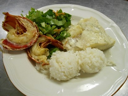 The hungry received a delicious plate of lobster, sole, salad and rice at the Kelowna Gospel Mission, Aug. 21, 2014.