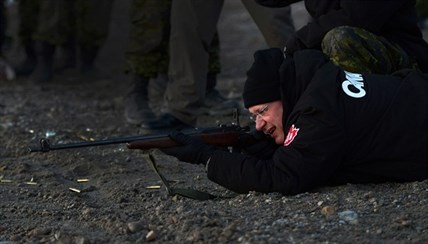 Prime Minister Stephen Harper shoots .303 Lee Enfield rifle's in Gjoa Haven, Nunavut on Tuesday, August 20, 2013. The prime minister, who is on his annual tour of the North, is no stranger to the rifles. During last year's visit, Harper got down on the ground, sniper-style, and fired off a few shots during target practice with the Rangers. 