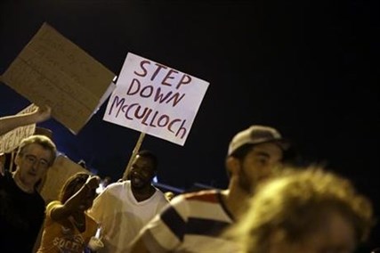 Protesters march Thursday, Aug. 21, 2014, in Ferguson, Mo.