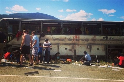 A tour bus is badly damaged and many people injured following a crash on the Coquihalla Highway Thursday, Aug. 28, 2014.