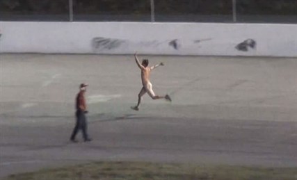 The crowd at the Motoplex Speedway in Spallumcheen cheered as a streaker ran the track between races on Saturday, Sept. 13, 2014.